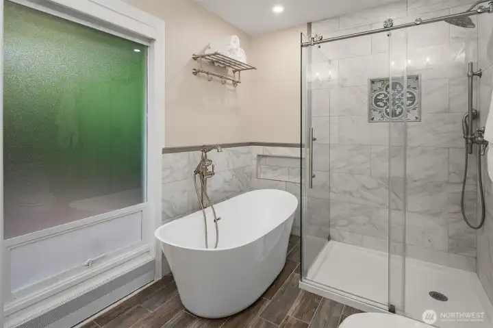 The primary bath also features a seperate shower and vessel tub.
