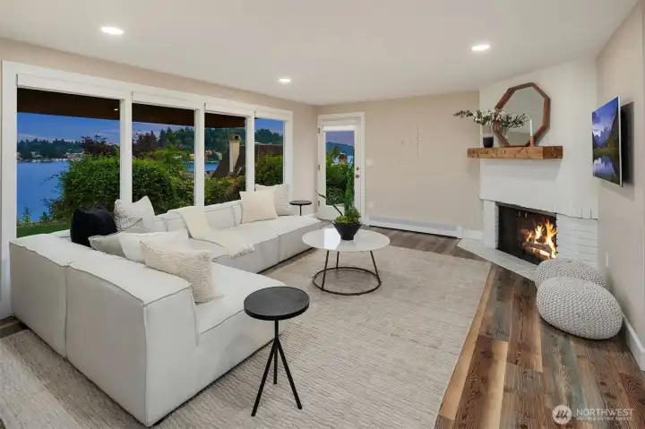The family room features a fireplace and access to the huge backyard.