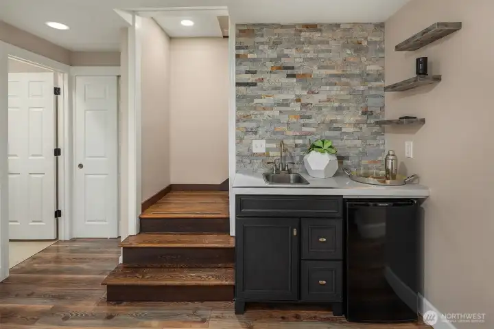 The family room also offers a wet bar, perfect for entertaining, watching football or a movie.
