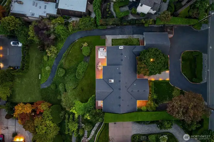 This photo gives a good depiction of the lot size and configuration as it is nicely outlined by shrubs for privacy,
