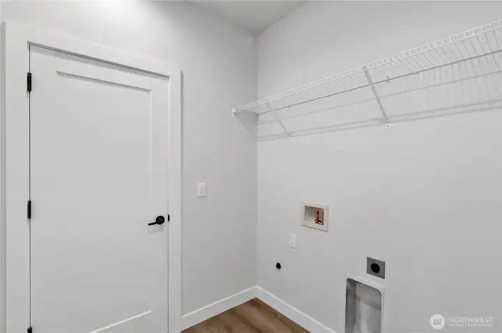 Utility Room & Entrance to Garage w/remote controlled doors.