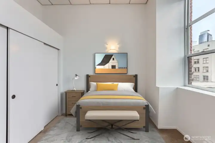 Enjoy all this natural light. Bedroom easily fits a king bed with 1 night stand or a queen with 2. Virtually staged.