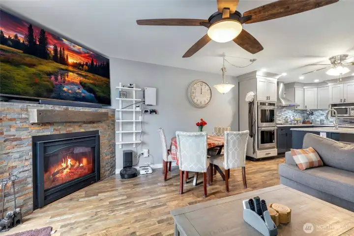 Another view of the lovely fireplace, dining area and living room