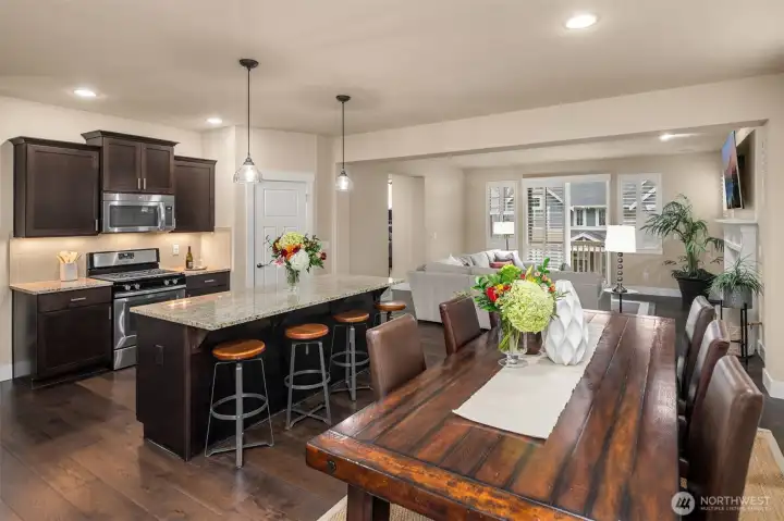 Open concept on the main floor between kitchen, dining, & living rooms