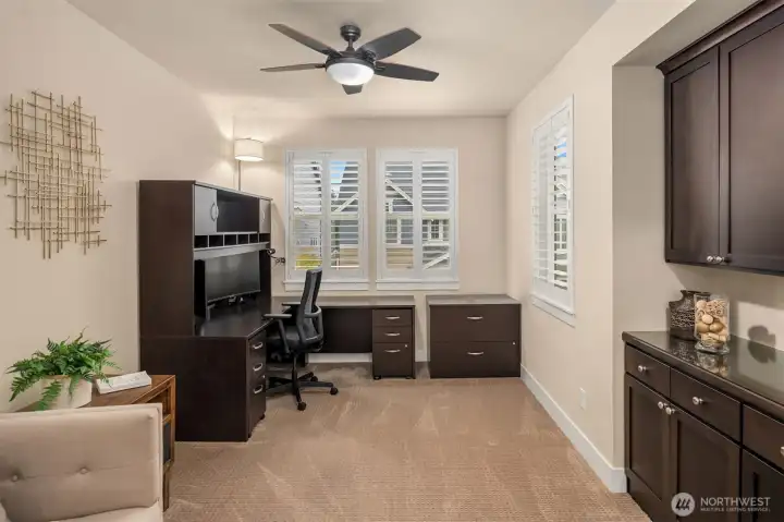 Office space w/ built in cabinets, also located on main floor