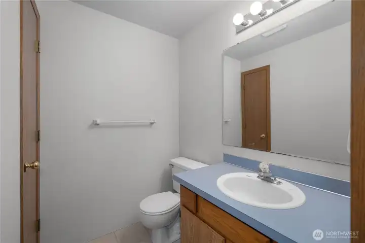 Convenient half bathroom located off the main living areas, ideal for guests.