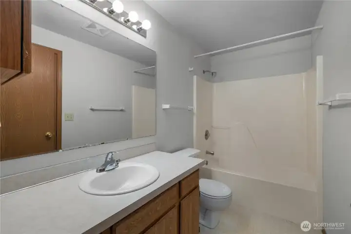 Full bathroom featuring a functional layout and well-maintained fixtures.