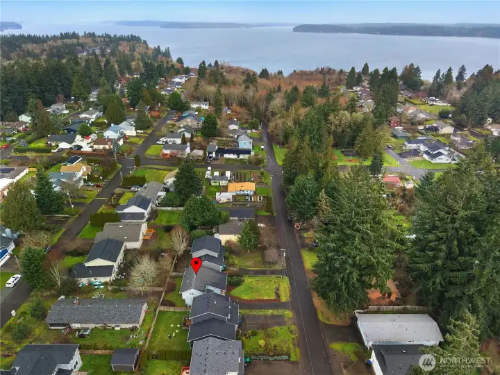 Aerial view highlighting the home’s location within the Beachcrest community and proximity to private amenities.