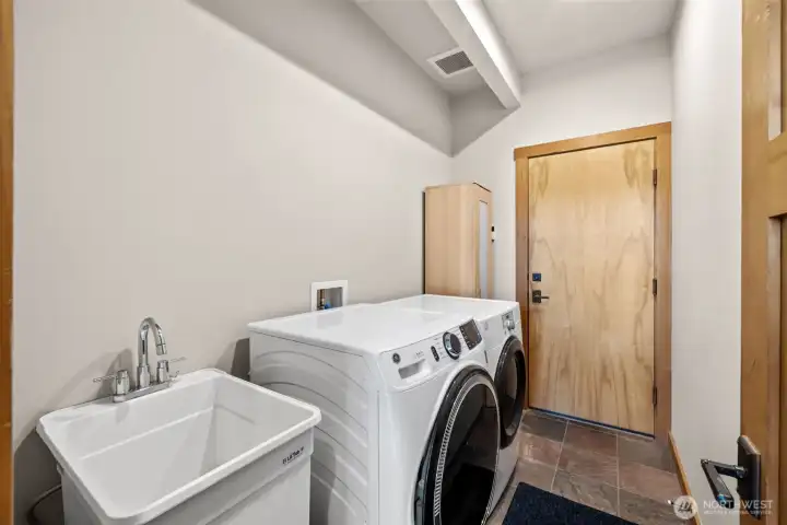 Laundry, wash basin as you go to the garage