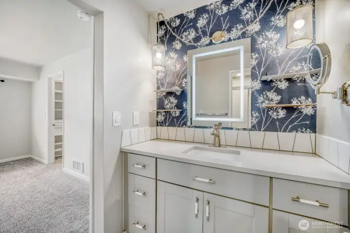 Bathroom with his and hers vanities