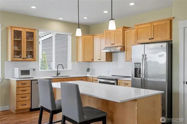 Kitchen updates include quartz counters and backsplash, newer sink & faucet, range hood, Electric Induction Range with oven, dishwasher and microwave. All cabinets hardware replaced with Oil Rubbed Bronze handles & knobs.