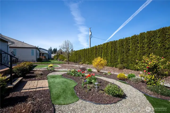 completely redesigned front & back yard, has many plants and flowers and artificial grass so you don't have to mow!!