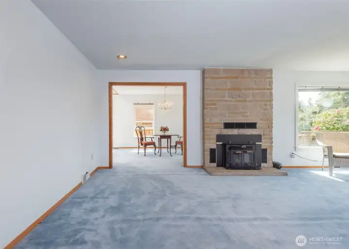 Looking from entry through living room to dining room.