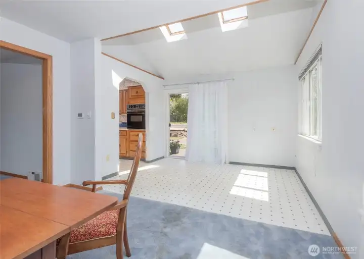 Kitchen eating space with slider to patio.