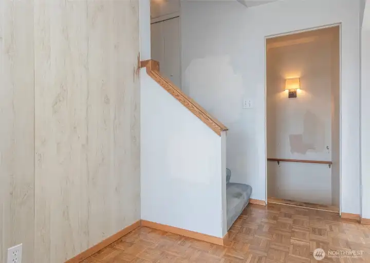 Stairs off entry leading to second level and door to lower level.