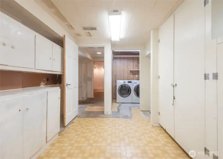 Large  storage room and laundry, partially plumbed for bath.