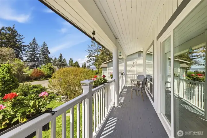 Front porch. Peak-a-boo views of Puget Sound. Great for morning coffee and sunset views.