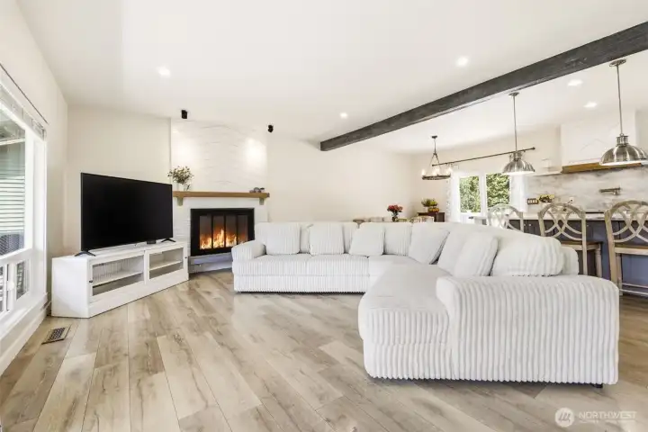 Large living room with fireplace and mantle.