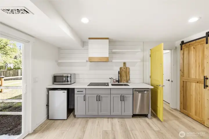 Kitchenette on bottom floor, complete with fridge, stove and dishwasher. Great as an ADU.