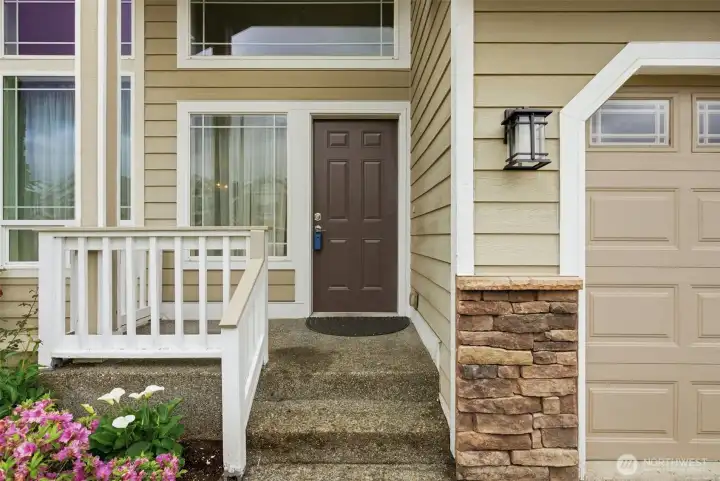 The charming front porch offers the perfect spot to relax and enjoy the welcoming feel of the home.