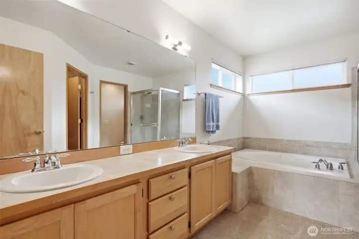 The spacious primary en-suite offers a private retreat with comfort and functionality.
