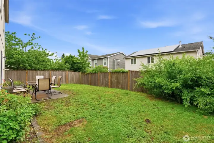 The level backyard offers plenty of room for outdoor living, play, and future possibilities.