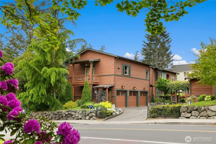 This photo was taken from across the street, (which is the best place to park your cars) when showing the home above the garages where other home owners need to have access to.
