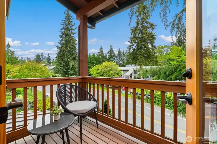 This view from the east side covered balcony faces toward a convenient parking area across the street.