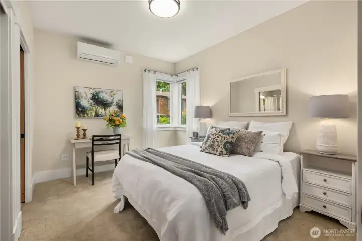 Efficient Mini-Split heating & cooling for the home and wall to wall carpeting in the bedroom with a generous closet and door leading to the full bath.