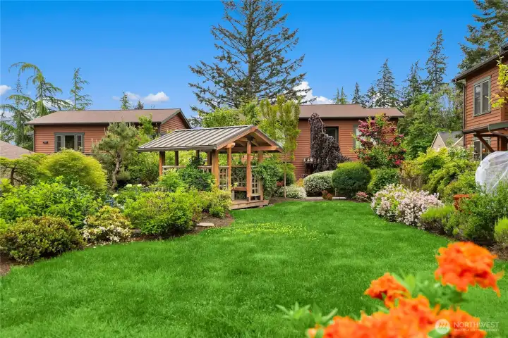 This shows the home for sale on the left beyond the Gazebo.