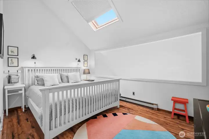 Upper larger bedroom with loft overlooking the living room.