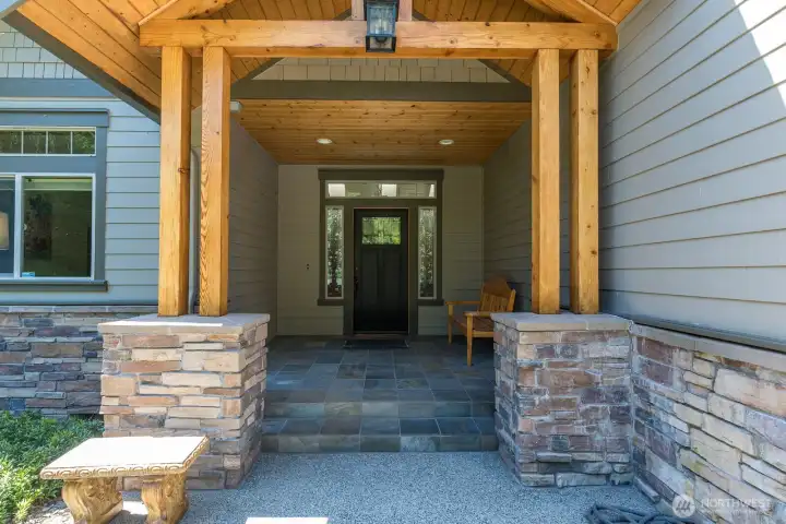 Warm beams and stone welcome you in to this beautiful home!