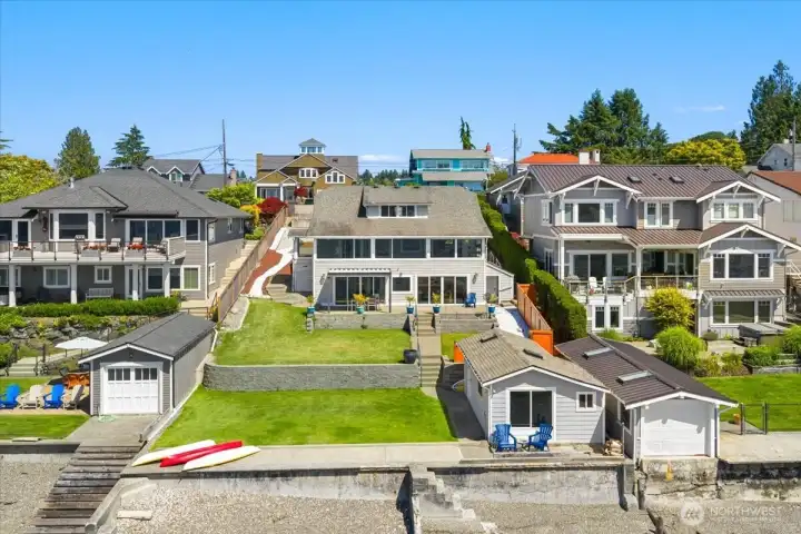 Aerial looking back towards the home from the water
