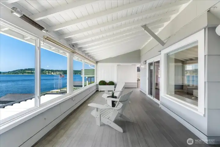 Covered porch adjacent to sun room