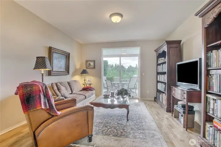 Family room with sliding door to patio with expansive views