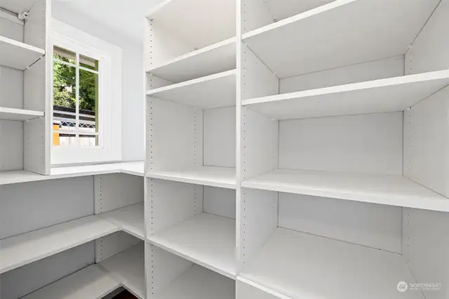 Front bedroom walk in closet with lots of built-ins.