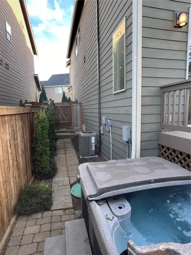 Spa and side yard with gate to front yard