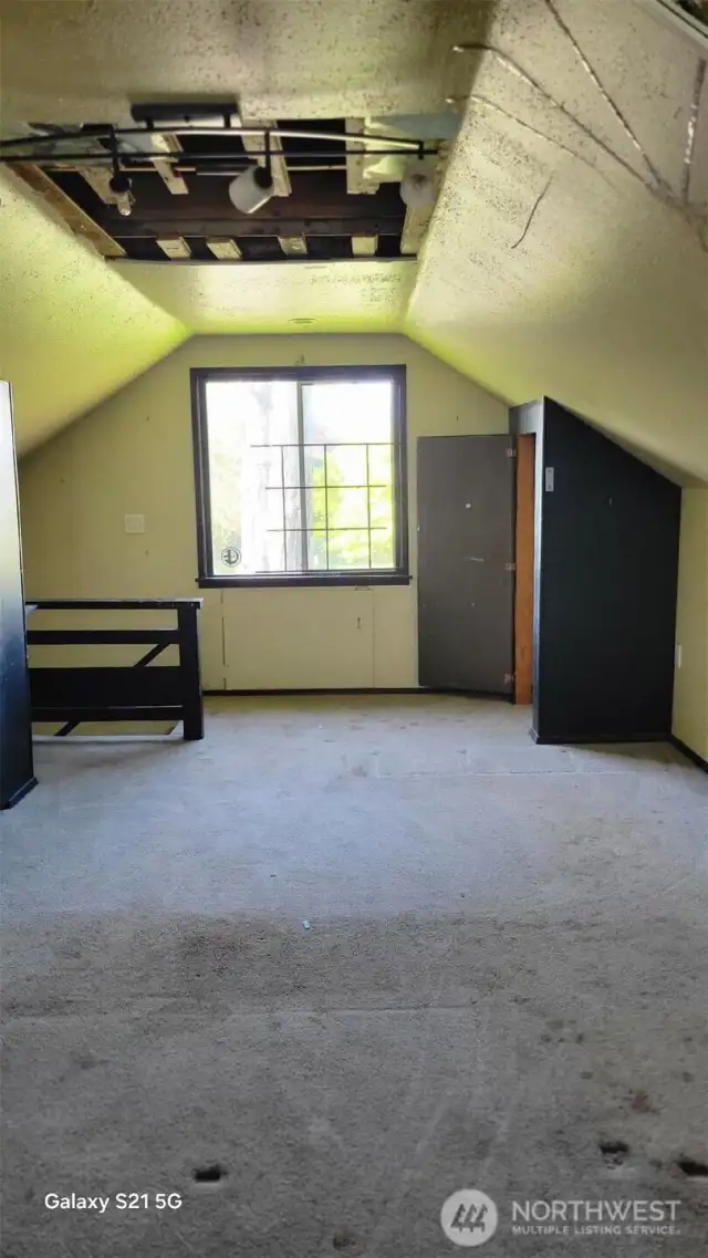 Upstairs bedroom with storage.