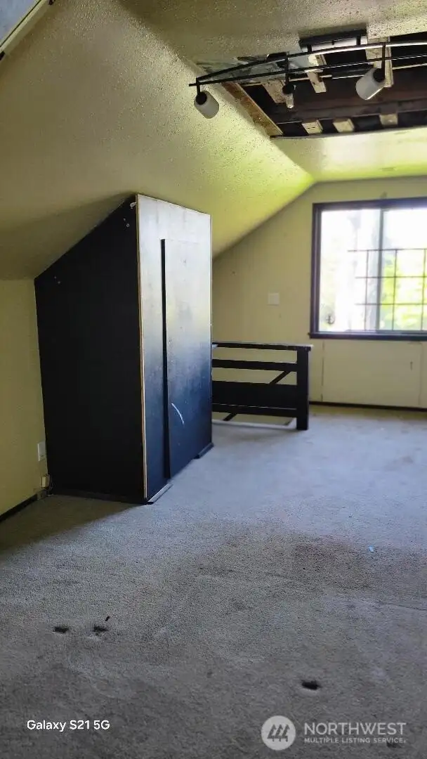 Upstairs bedroom with extra storage.