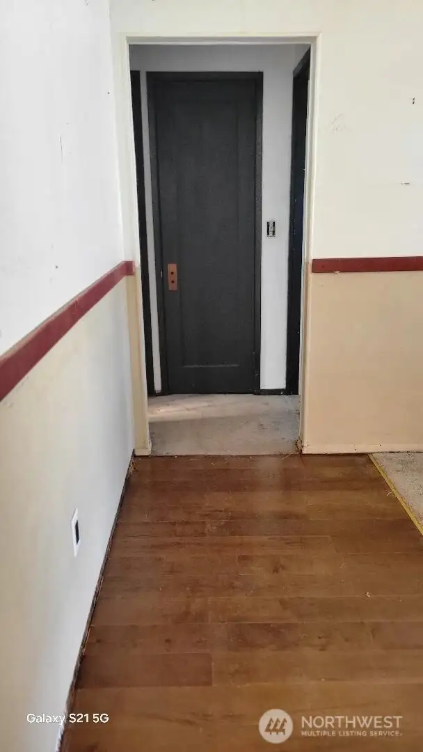 Hallway between living room and kitchen.