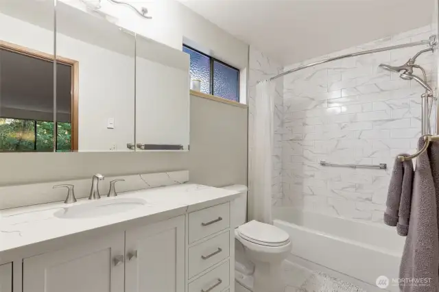 Stunning en-suite bathroom in primary bedroom.