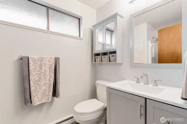 Remodeled main bathroom with walk-in shower.