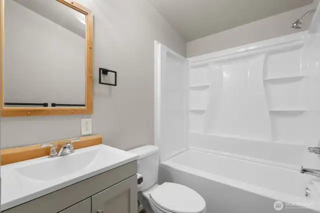 Hall bath with vanity and tub shower combo