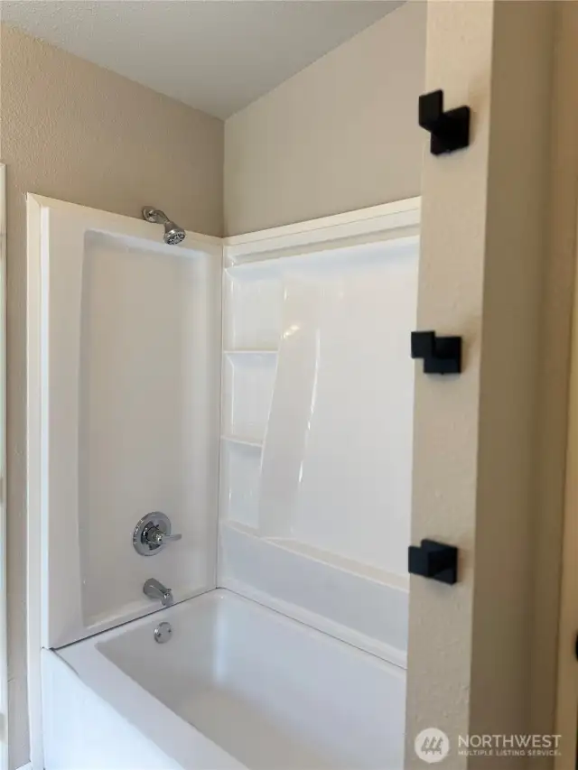 Primary bath new tub surround with towel hooks