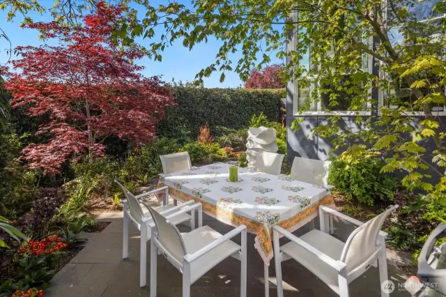Step right outside the formal dining room to the "al fresco" dining and cocktail spot and continue celebrating behind a privacy hedge amid a curated, colorful, park-like landscape