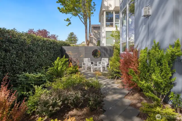 Out back, around the corner, and down the diagonal paver path is the perfect spot to rendezvous with your favorite Chardonnay