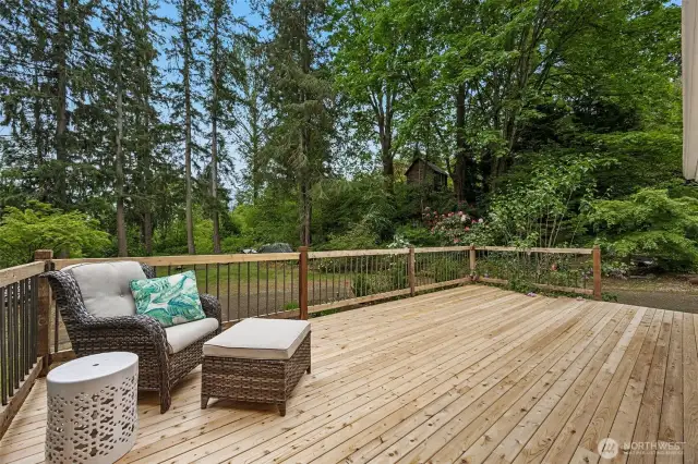 Main floor entry deck with view of yard
