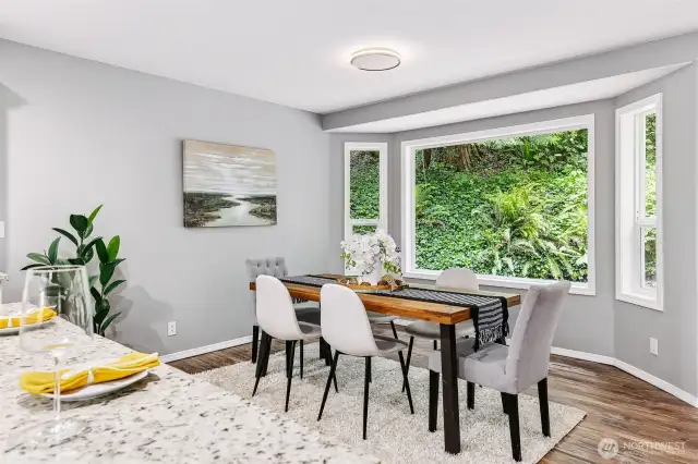 A spacious dining area with views out to the backyard.
