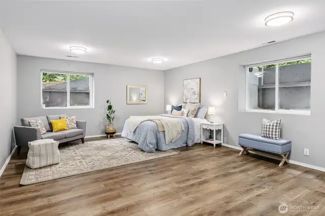 Spacious finished basement featuring two egress windows that fill the area with natural light. With the addition of a full bathroom, this space is ideal for an additional bedroom, guest suite or flex living space.