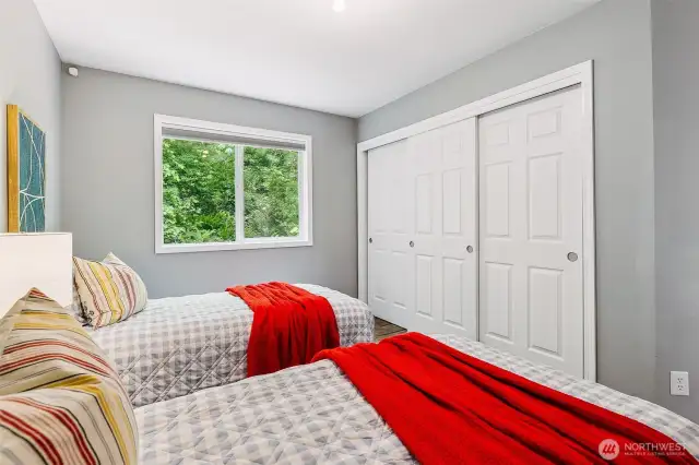 Secondary bedroom with large, double-wide closet.